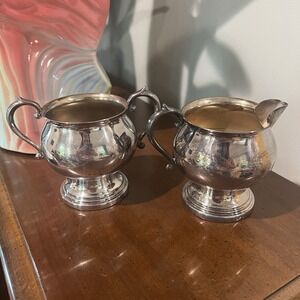 FB Rogers Silver Co Creamer and Sugar Bowl in silver on‎ copper